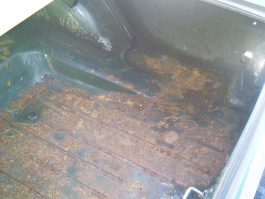 Rust on the passenger's side of the trunk