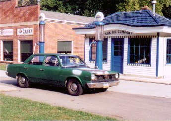 My American in front of a 1920's era Sun Oil gas station at Carillon Historical Park in Dayton, OH.